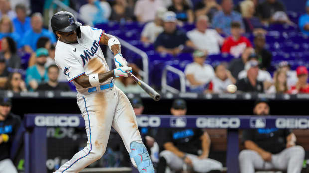 Sep 24, 2023; Miami, Florida, USA; Miami Marlins designated hitter Jorge Soler (12) hits a single against the Milwaukee Brewers during the eighth inning at loanDepot Park. Mandatory Credit: Sam Navarro-USA TODAY Sports  